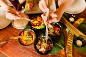 foto of restaurant  - Young people eating in a Thai restaurant - JPG 