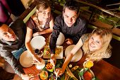 foto of restaurant  - Young people eating in a Thai restaurant - JPG 