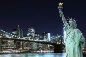 stock photo of bridge  - Brooklyn Bridge and The Statue of Liberty at Night - JPG 