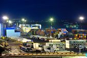 pic of discharge  - Port warehouse with cargoes and containers at night - JPG 