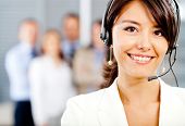 picture of telemarketing  - Female customer support operator with headset and smiling - JPG 