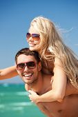 picture of beach  - picture of happy couple in sunglasses on the beach  - JPG 