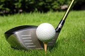 stock photo of golf  - Golf ball on a tee with driver - JPG 