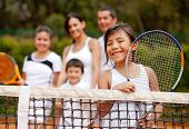 picture of family  - Girl tennis player with her family at the background - JPG 