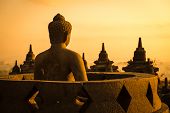 pic of religion  - Buddha statue in open stupa in Borobudur or Barabudur temple Jogjakarta Java Indonesia at sunrise - JPG 