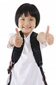pic of youngster  - Thumbs up primary school girl with backpack on white background - JPG 