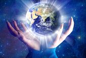 foto of earth  - female hands with the planet Earth over starry universe like a concept of new spiritual era - JPG 