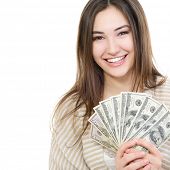 stock photo of cash  - Cheerful attractive young lady holding cash and happy smiling over white background - JPG 