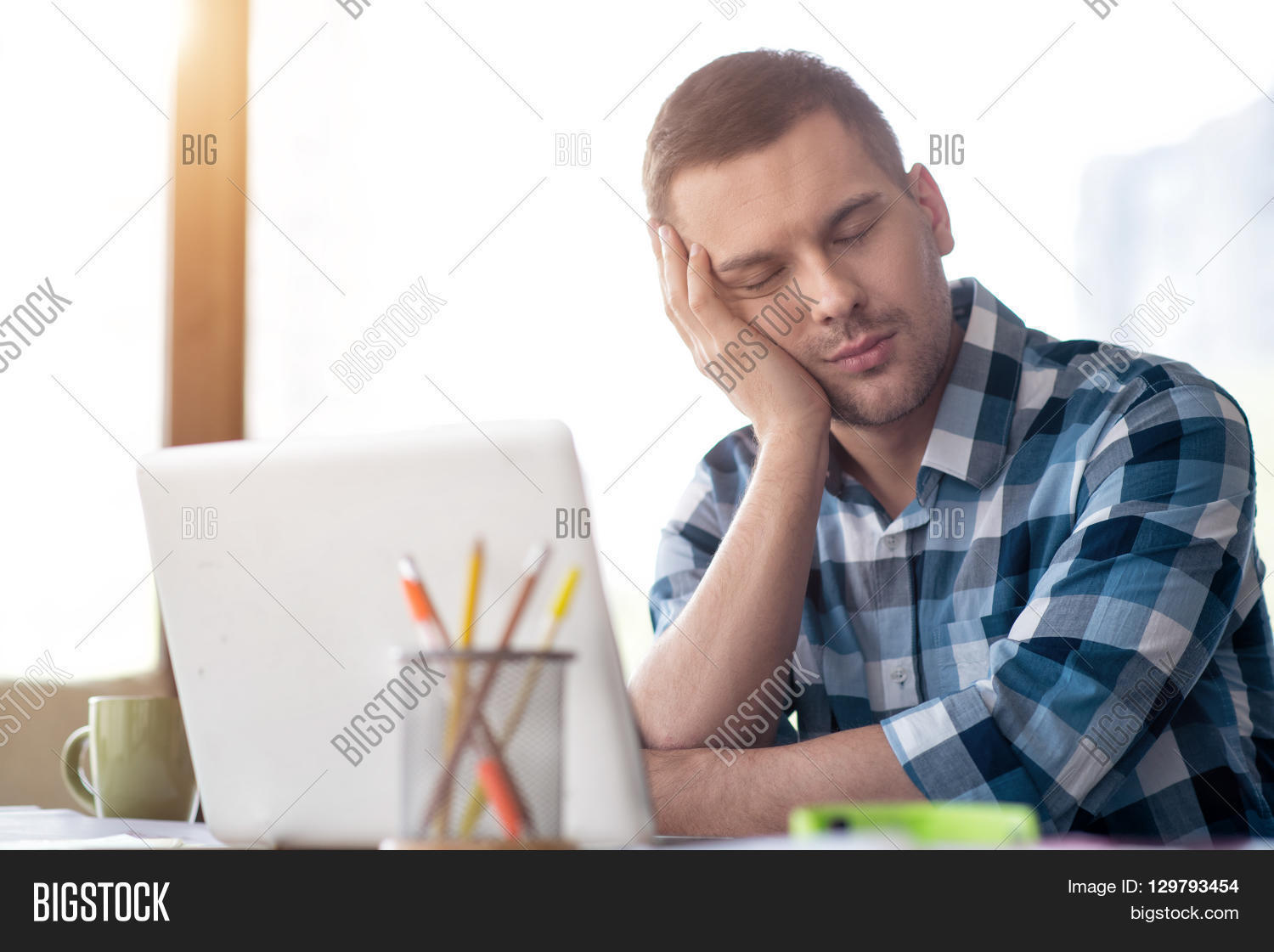 crating a while at work tired after work pleasant handsome exhausted sitting at the table and sleeping crating a while at work tired after work pleasant handsome exhausted sitting at the table and sleeping