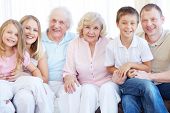 picture of home  - Portrait of senior and young couples with their children looking at camera at home - JPG 