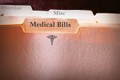 stock photo of medical  - tabbed folders with Medical Bills text and logo - JPG 