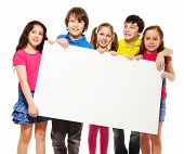image of boy  - Happy smiling group of kids friends boys and girls showing blank placard board to write it on your own text isolated on white background - JPG 