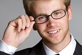 stock photo of business people  - Smiling happy businessman wearing eye glasses closeup - JPG 