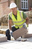 picture of construction worker  - Construction Worker Laying Blockwork - JPG 