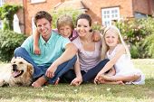 picture of dog  - Family Sitting In Garden Together - JPG 