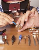 picture of watch  - Watch repair craftsman repairing watch - JPG 