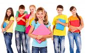 stock photo of group  - Group of happy teen school child with book - JPG 