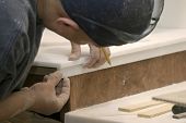 foto of construction worker  - construction worker pieces together the countertop - JPG 