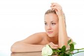stock photo of beauty  - beautiful woman portrait with rose over white with copy space - JPG 