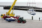 picture of boat  - At start of the sailing season boats and yachts are heaved into the water at the harbour of Hoernum on the Island of Sylt - JPG 