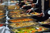 pic of food  - people group catering buffet food indoor in luxury restaurant with meat colorful fruits  and vegetables - JPG 