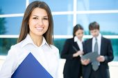 stock photo of business people  - Beautiful woman on the background of business people - JPG 