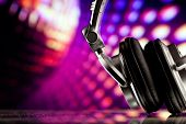 picture of headphones  - headphones against purple disco background - JPG 