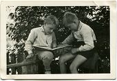stock photo of  photo  - Vintage photo of brothers reading a book  - JPG 