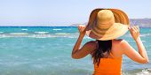 stock photo of beach  - Woman standing on shoreline at the beach - JPG 