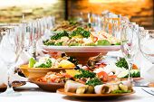 stock photo of restaurant  - catering table set service with silverware and glass stemware at restaurant before party - JPG 