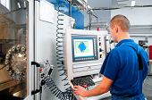 picture of industrial  - mechanical technician operative of cnc milling cutting machine center at tool workshop - JPG 