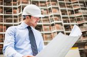 picture of construction  - Portrait of an architect in front of a construction site - JPG 