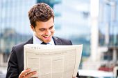 picture of newspaper  - Business man reading a newspaper - JPG 