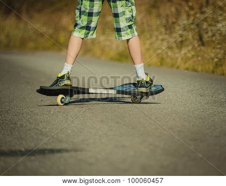 Legs in sneakers on a waveborde