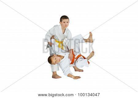 The athletes in judogi perform throws judo