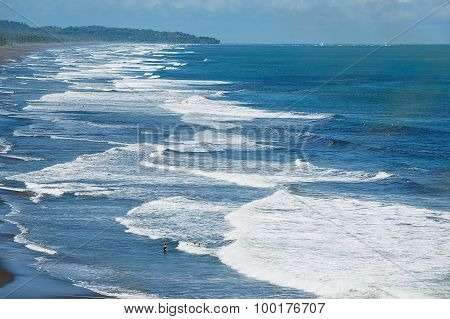 People bathe in the Pacific ocean in Jaco, Costa Rica.