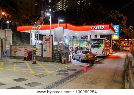 HONG KONG - APRIL 15, 2015: Caltex fuel station at evening. Caltex is a petroleum brand name of Chevron Corporation used in more than 60 countries
