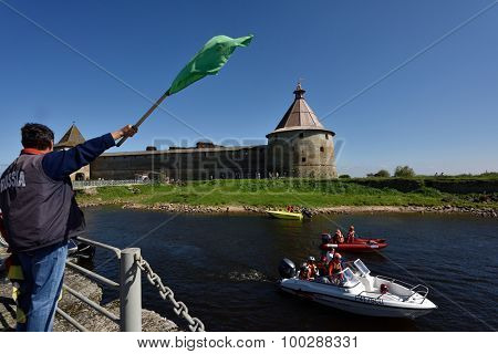 ORESHEK FORTRESS, LENINGRAD OBLAST, RUSSIA - AUGUST 15, 2015: Athletes prepare to second stage of the River marathon Oreshek Fortress race. This international motorboat competitions is held since 2003