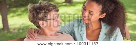 Elderly Woman Relaxing In Garden