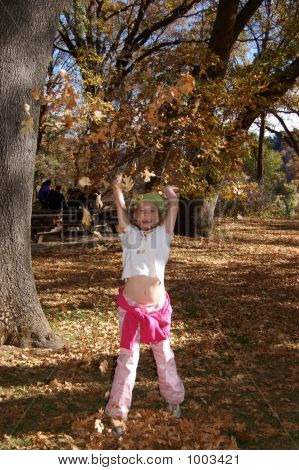 Girl Tossing Leaves