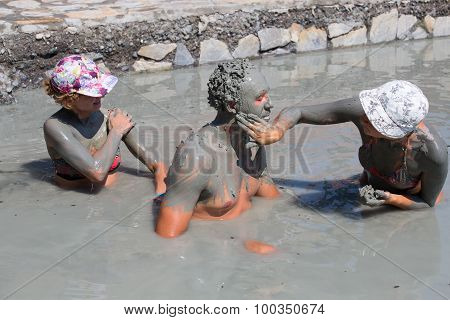 People In Grey Mud Bath. Dalyan, Turkey