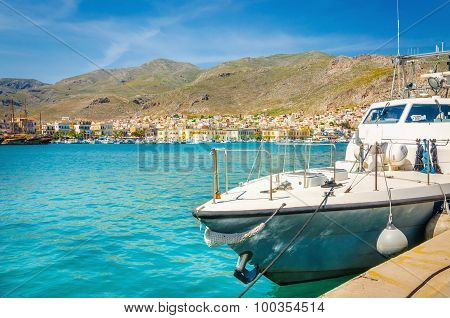 Small speed boat moored on clear water, Greece