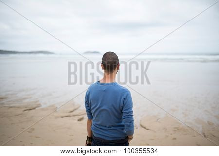 Man In The Beach Looking To The Sea