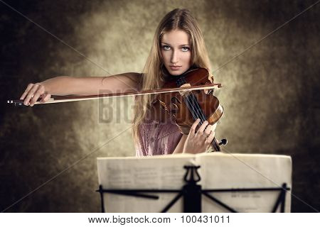 Pretty Young Violinist Playing The Violin