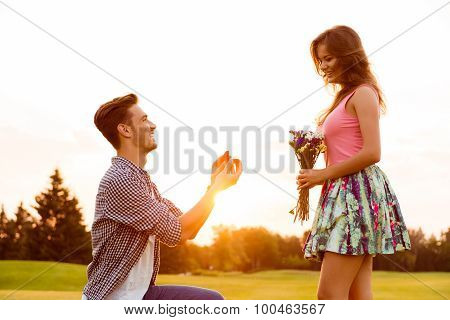Young Man Makes A Proposal Of Betrothal To His Girlfriend