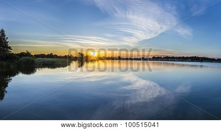 Sunset In Zinnowitz With Reflection Of The Backwater