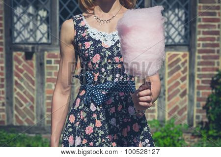 Young Woman With Candyfloss Outside