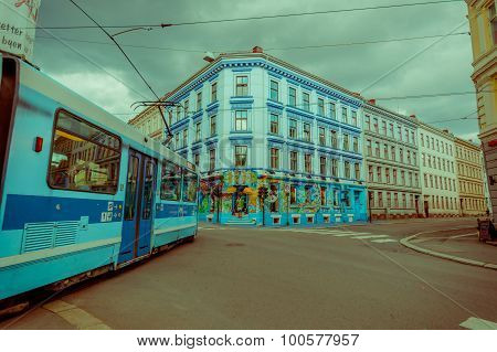 OSLO, NORWAY - 8 JULY, 2015: Tram passing through Grunerlokka neighbourhood next to Birkelunden park