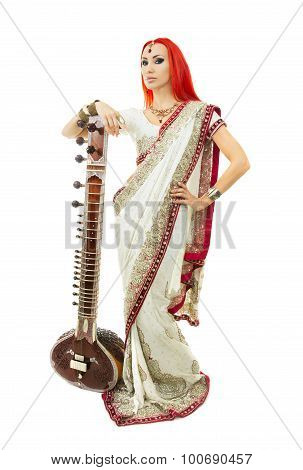 Beautiful Redhead Woman In Indian Sari With Oriental Jewelry Posing With Sitar