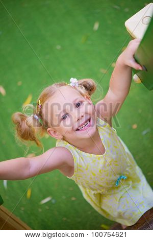 Cute Little Girl At Playgraund